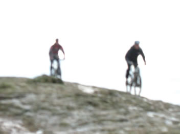 cyclists, snow, hill